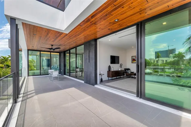 a spacious bedroom with a bed and a large window