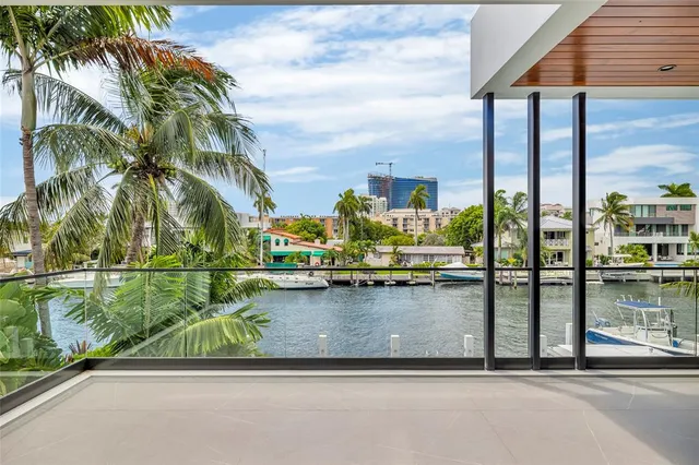 an aerial view of a city with lake view