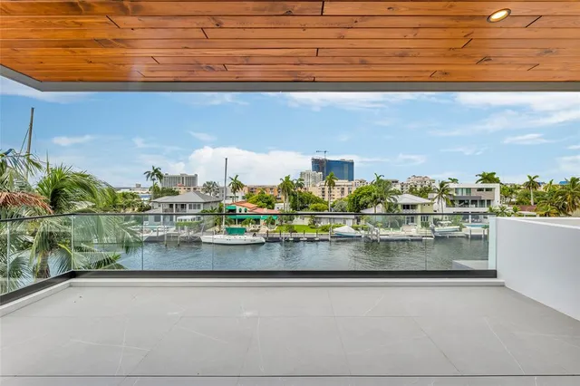 an aerial view of a house with outdoor space patio and trees all around