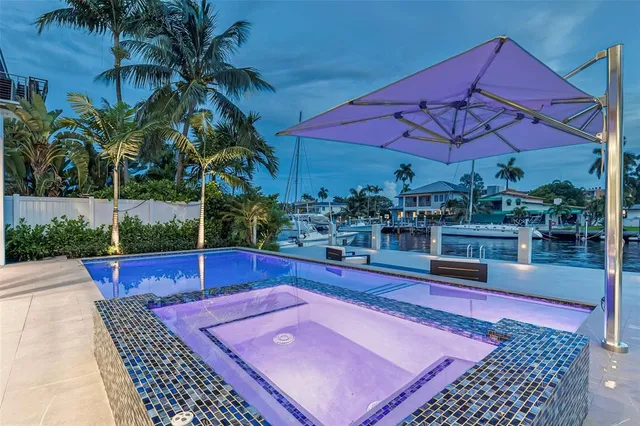a dining room with furniture a large window and a table