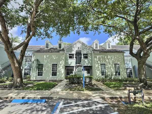 a view of a big yard in front of a house