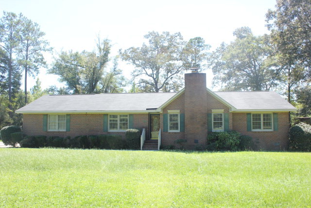 6350 Sandy Point Road Lizella, GA 31052 - Photo 1 of 25 a front view of a house with a garden