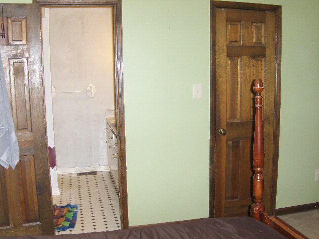 6350 Sandy Point Road Lizella, GA 31052 - Photo 10 of 25 a view of a bedroom from a hallway