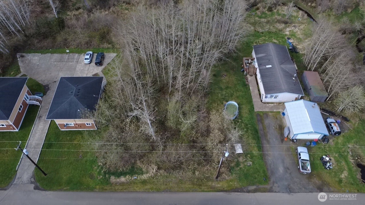 812 Thomas Street Aberdeen, WA 98520 - Photo 8 of 13 an aerial view of residential houses with outdoor space and parking