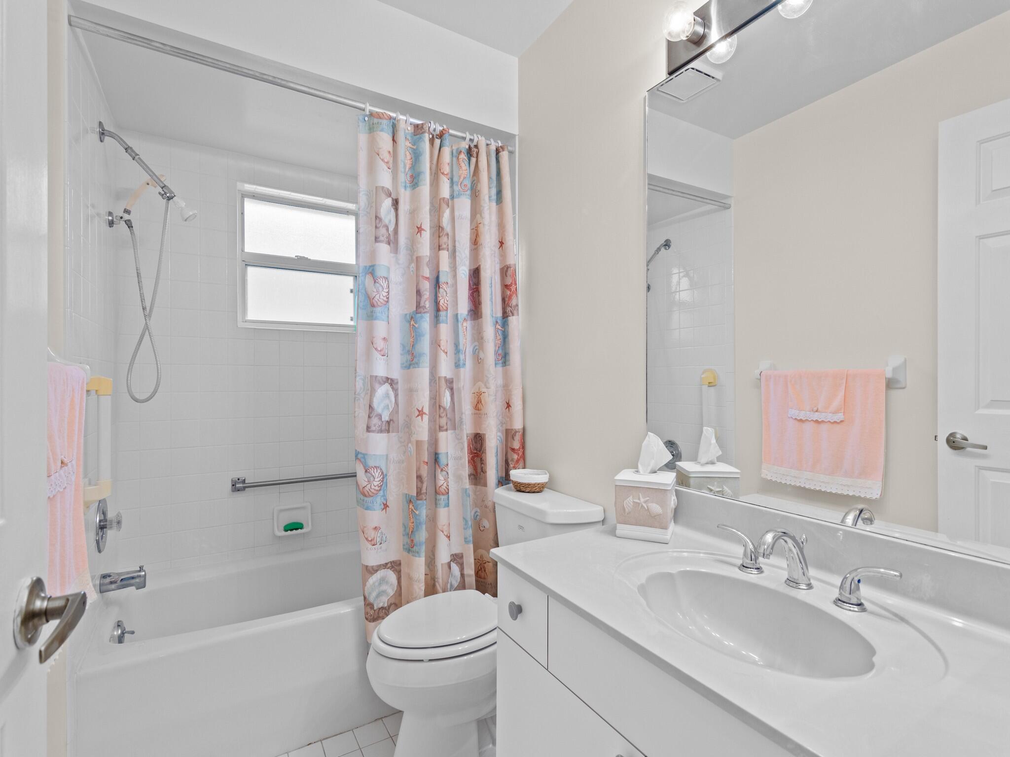 992 Seneca Avenue Sebastian, FL 32958 - Photo 22 of 26 a bathroom with a sink toilet tub and shower