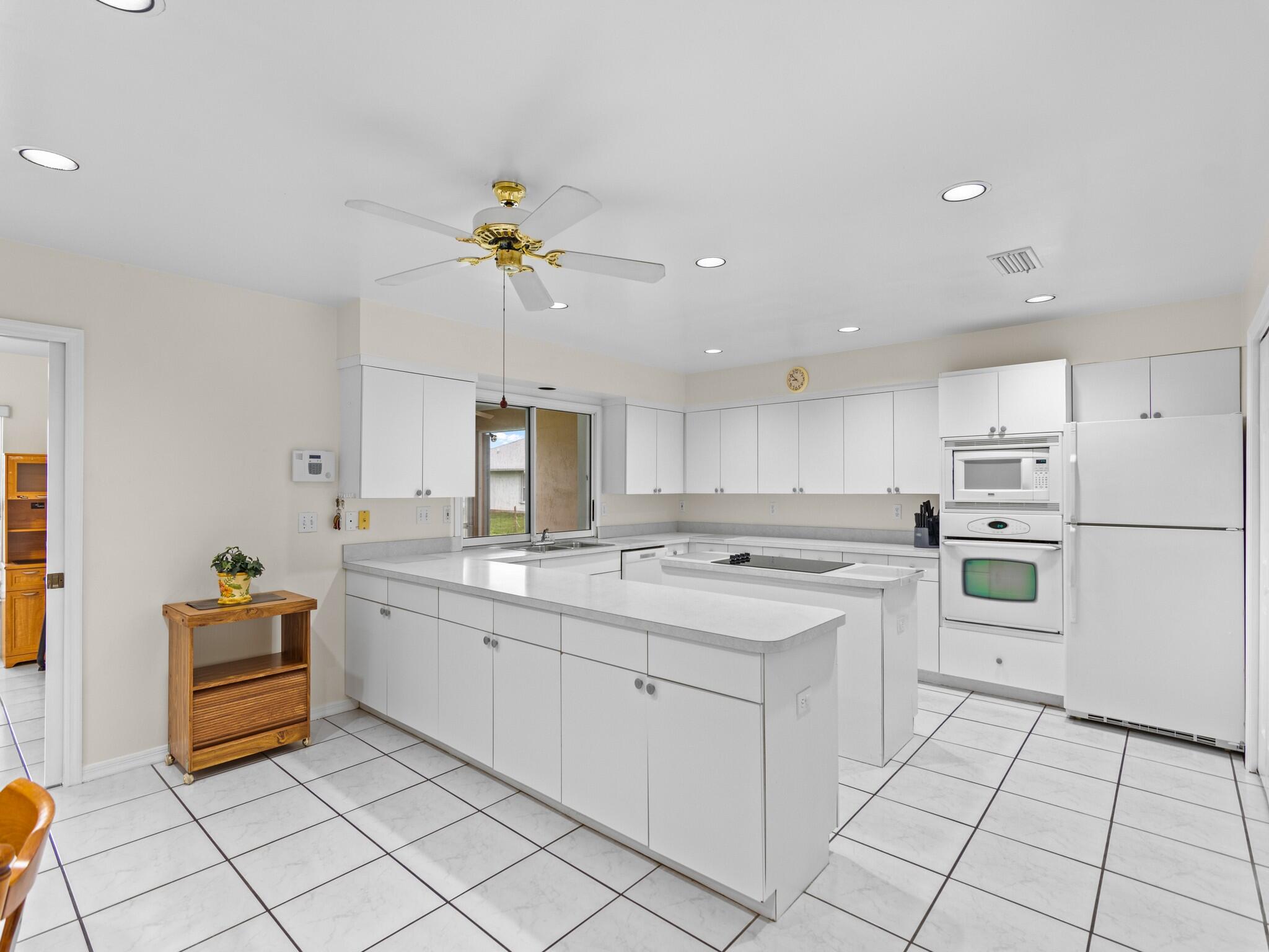 992 Seneca Avenue Sebastian, FL 32958 - Photo 7 of 26 a kitchen with a sink appliances and cabinets