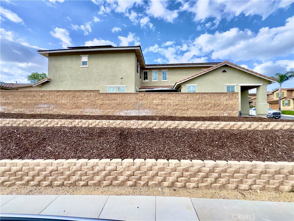11265 Runyan Road Beaumont, CA 92223 - Photo 101 of 138 Side view of the corner lot, elevated above the street level.