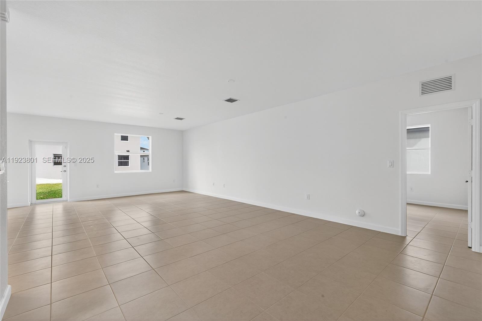 19431 Southwest 340th Street Homestead, FL 33034 - Photo 12 of 48 a view of an empty room with a window