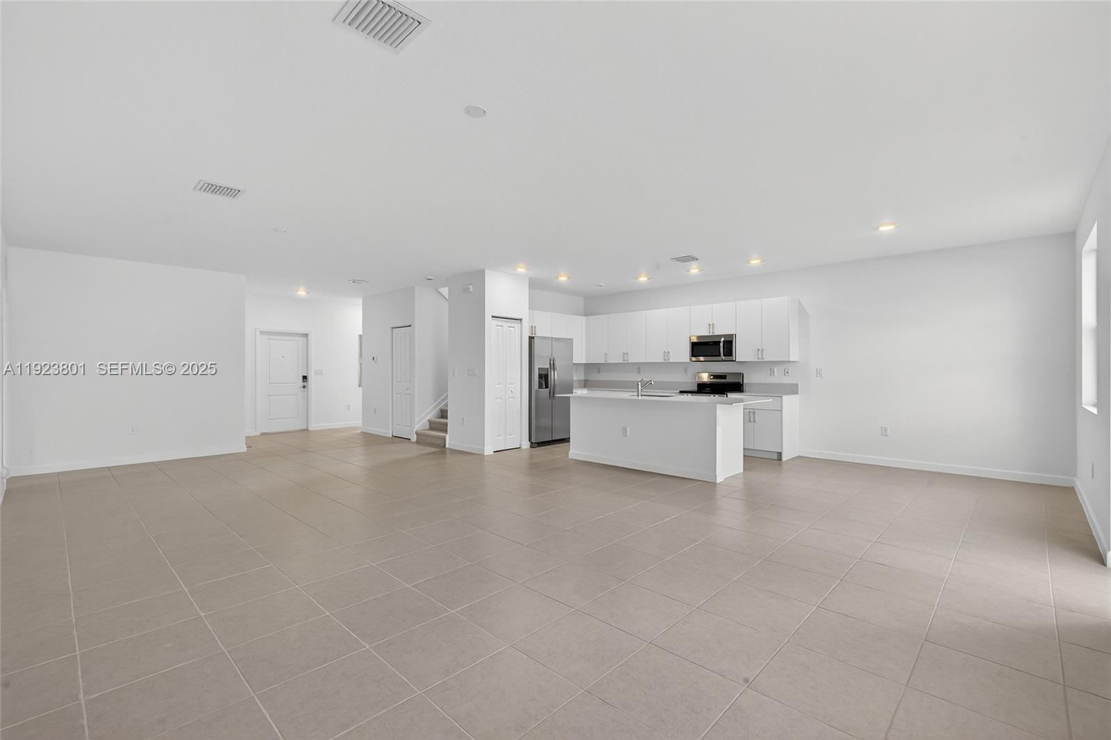 19431 Southwest 340th Street Homestead, FL 33034 - Photo 13 of 48 a view of a kitchen with refrigerator and a sink