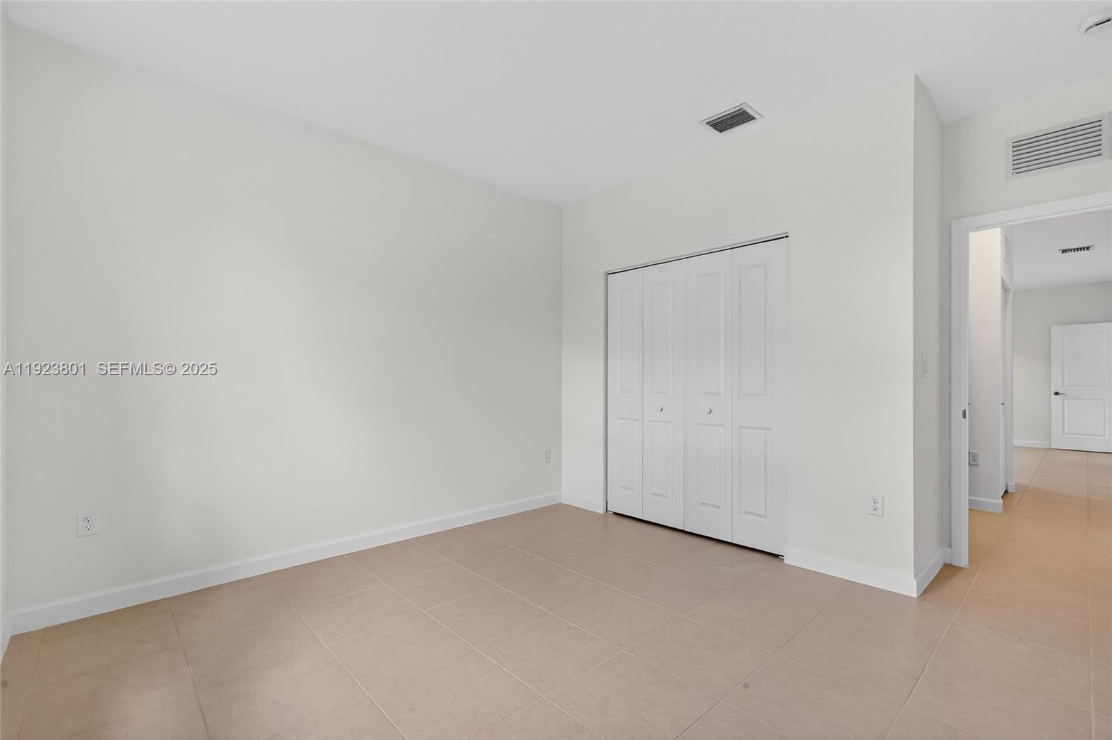 19431 Southwest 340th Street Homestead, FL 33034 - Photo 16 of 48 a view of an empty room