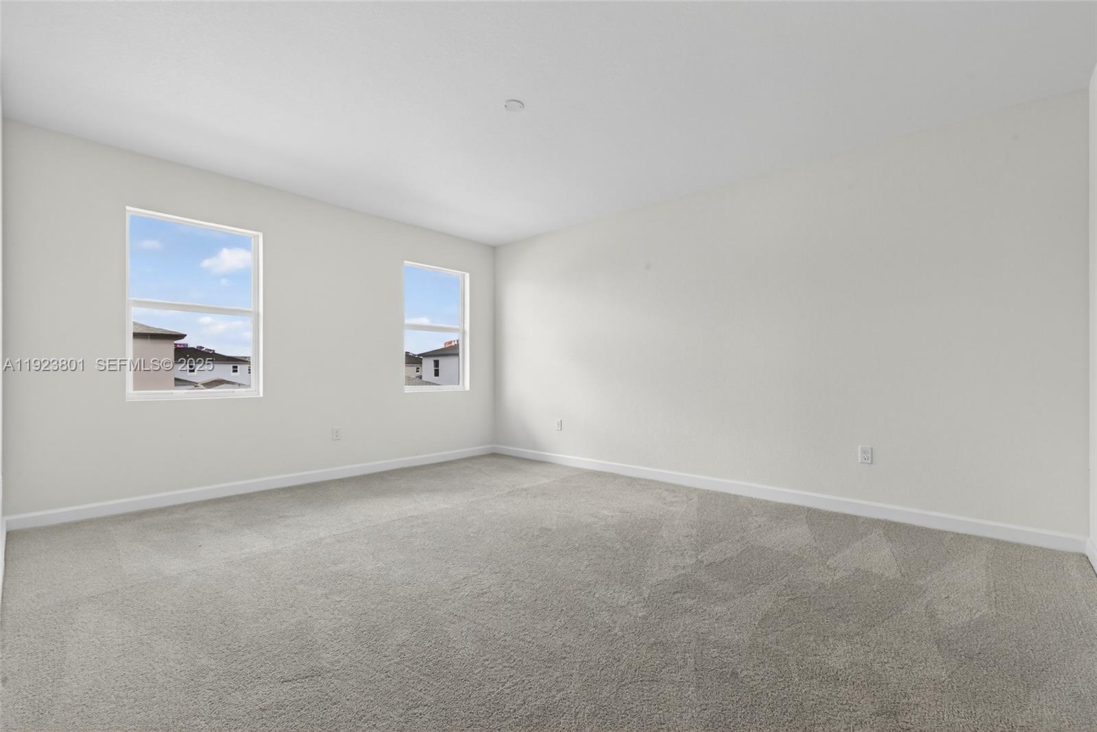 19431 Southwest 340th Street Homestead, FL 33034 - Photo 19 of 48 an empty room with windows