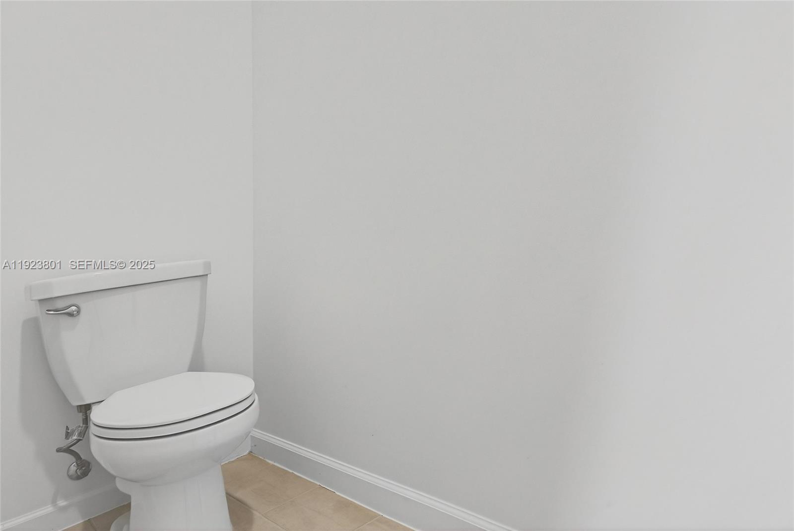 19431 Southwest 340th Street Homestead, FL 33034 - Photo 20 of 48 a white toilet sitting next to a white wall