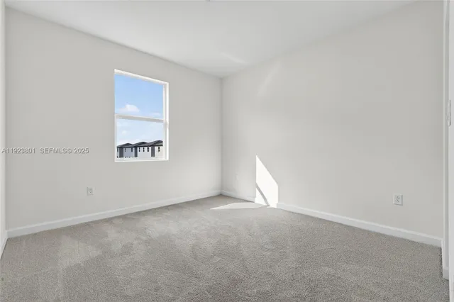 a kitchen with stainless steel appliances a sink stove and white cabinets