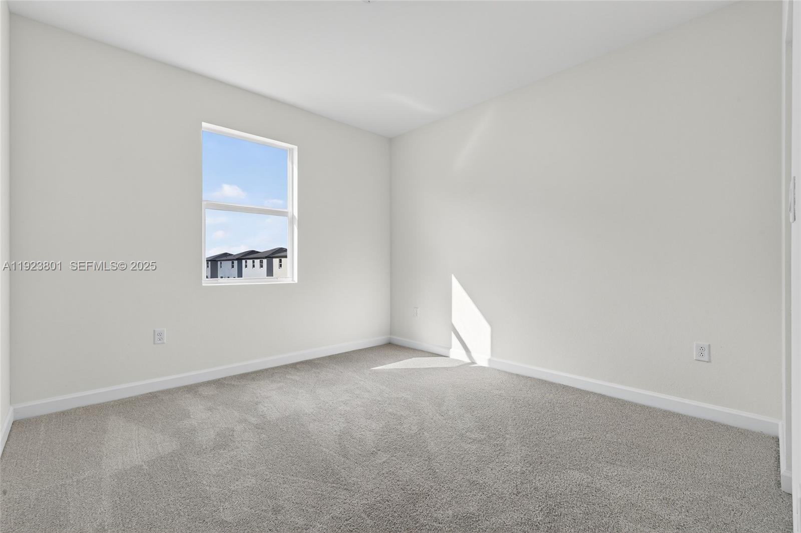 19431 Southwest 340th Street Homestead, FL 33034 - Photo 23 of 48 an empty room with windows