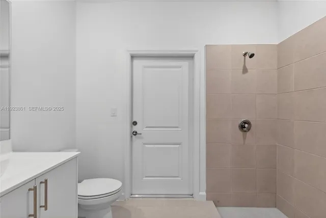 a bathroom with a sink toilet and vanity