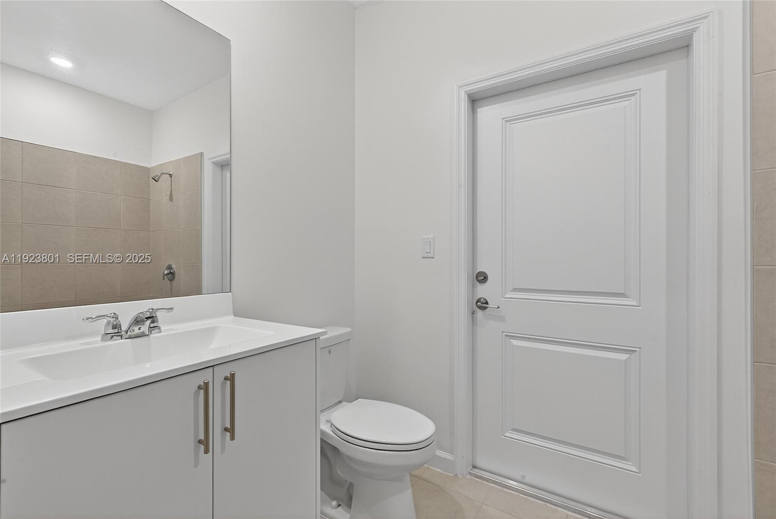 19431 Southwest 340th Street Homestead, FL 33034 - Photo 29 of 48 a bathroom with a sink toilet and vanity