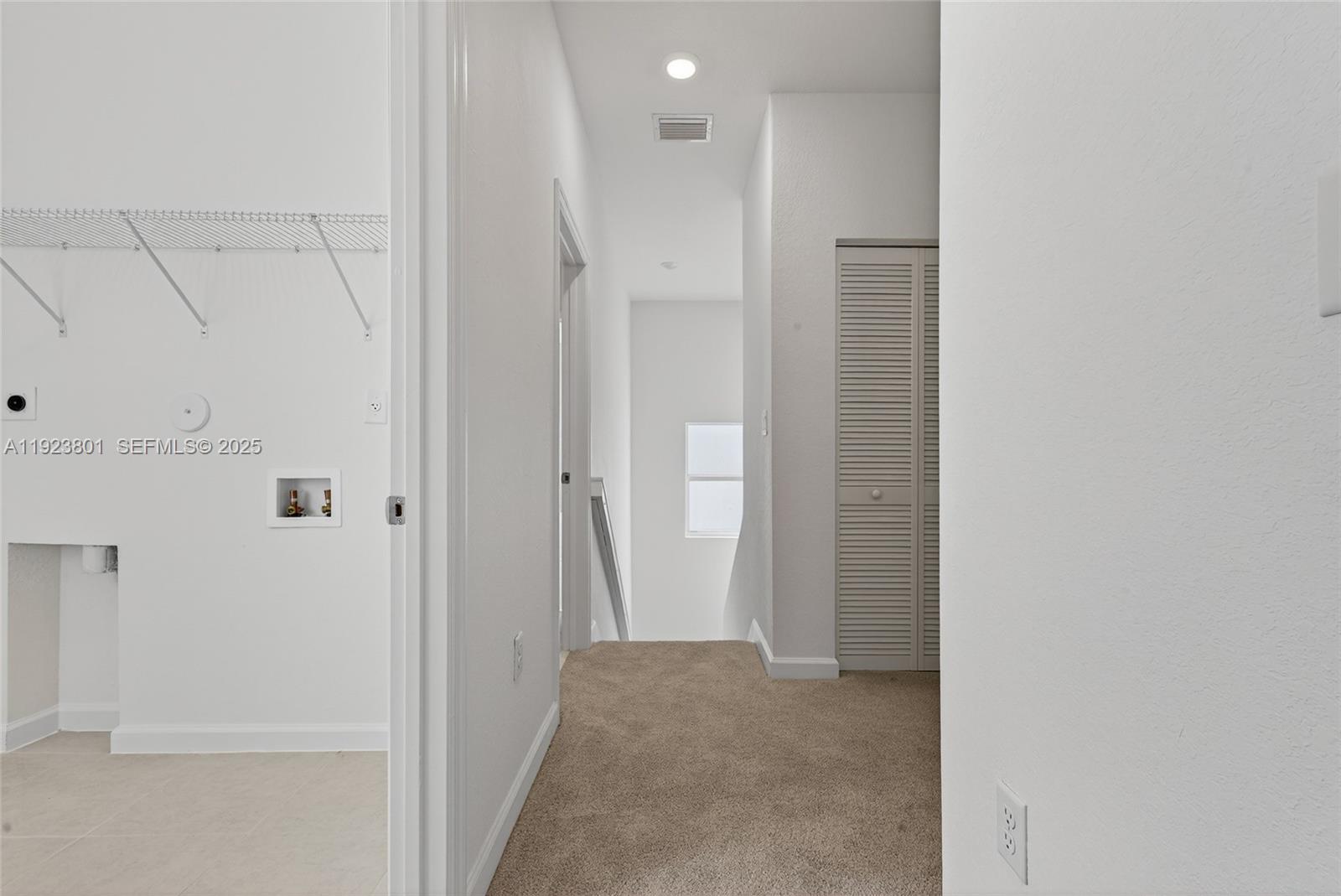 19431 Southwest 340th Street Homestead, FL 33034 - Photo 38 of 48 a view of a hallway with white walls
