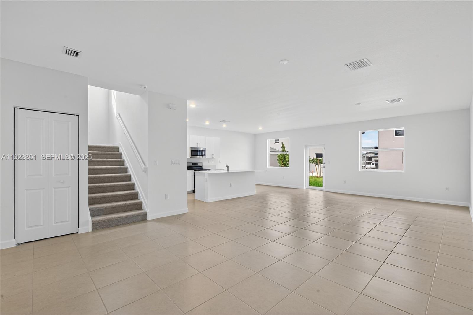 19431 Southwest 340th Street Homestead, FL 33034 - Photo 10 of 48 a view of a livingroom with wooden floor and stairs