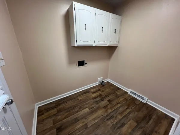 a view of small space with wooden floor