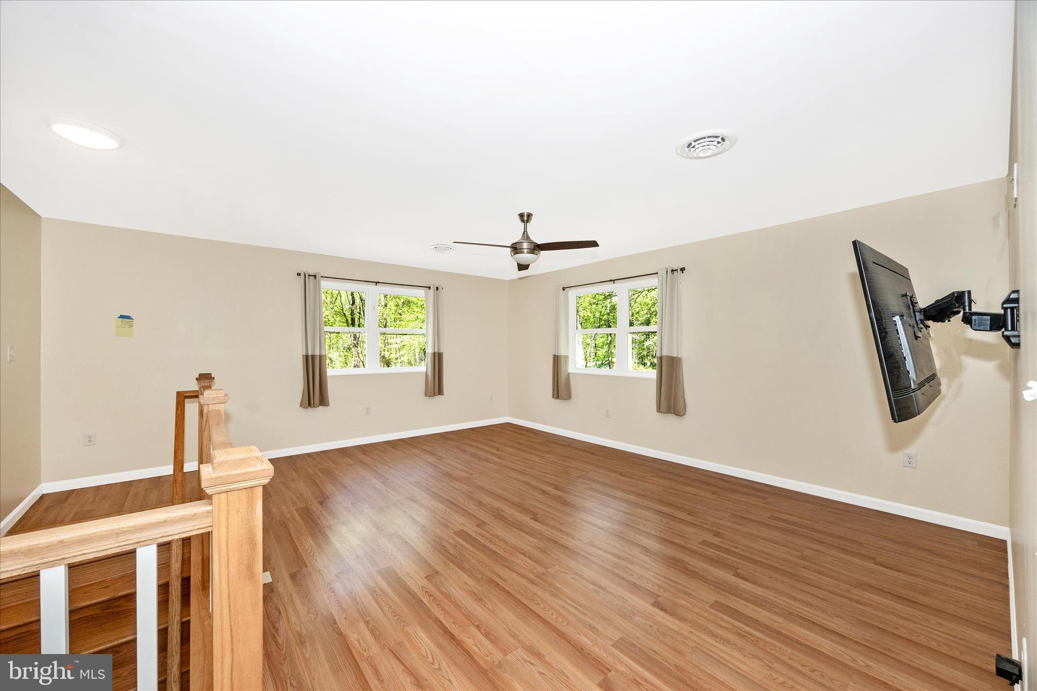 6518 Woodville Road Mount Airy, MD 21771 - Photo 24 of 53 wooden floor in an empty room with a window