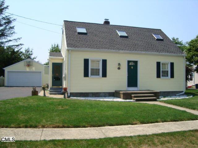 a front view of house with yard