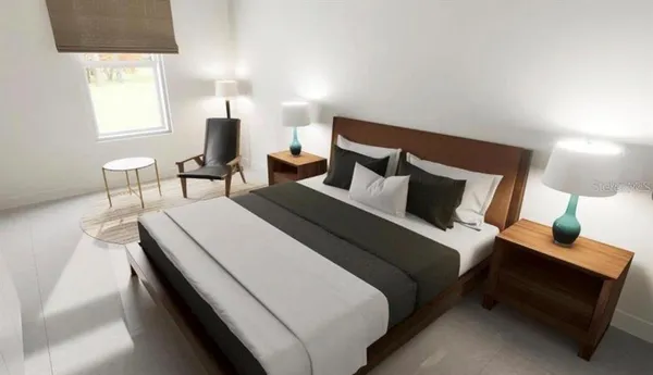 a bedroom with a bed and a lamp