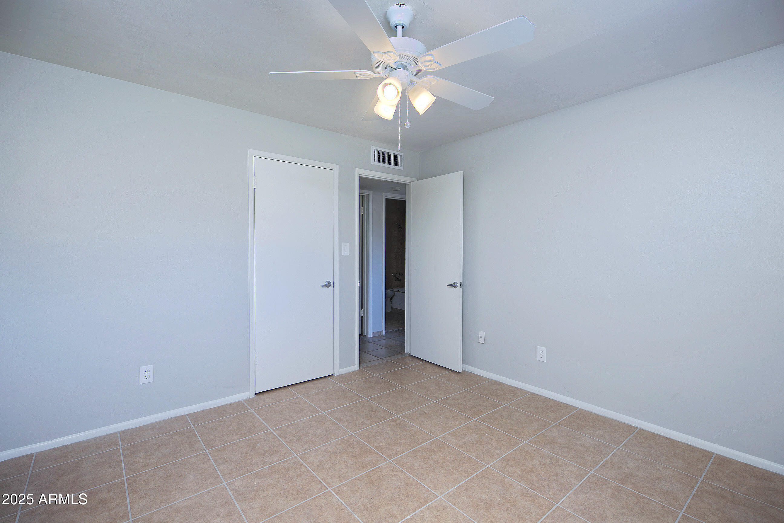 1206 West 9th Street Tempe, AZ 85281 - Photo 16 of 23 an empty room with a ceiling fan and a fan