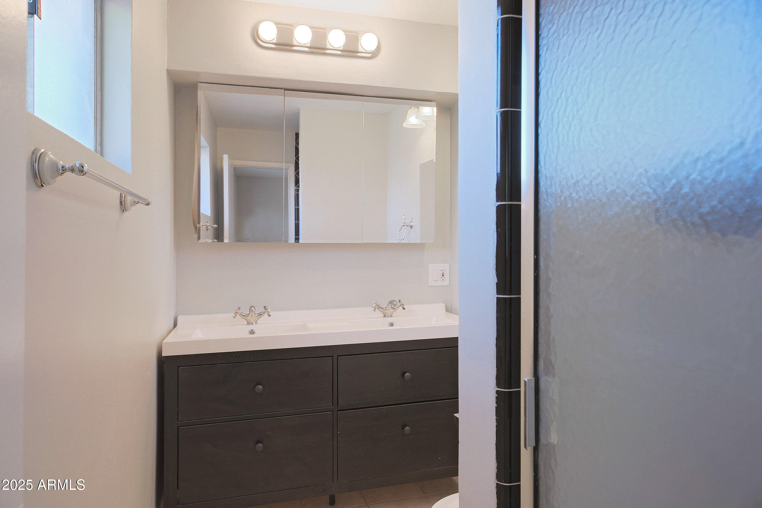 1206 West 9th Street Tempe, AZ 85281 - Photo 19 of 23 a bathroom with a sink and a mirror