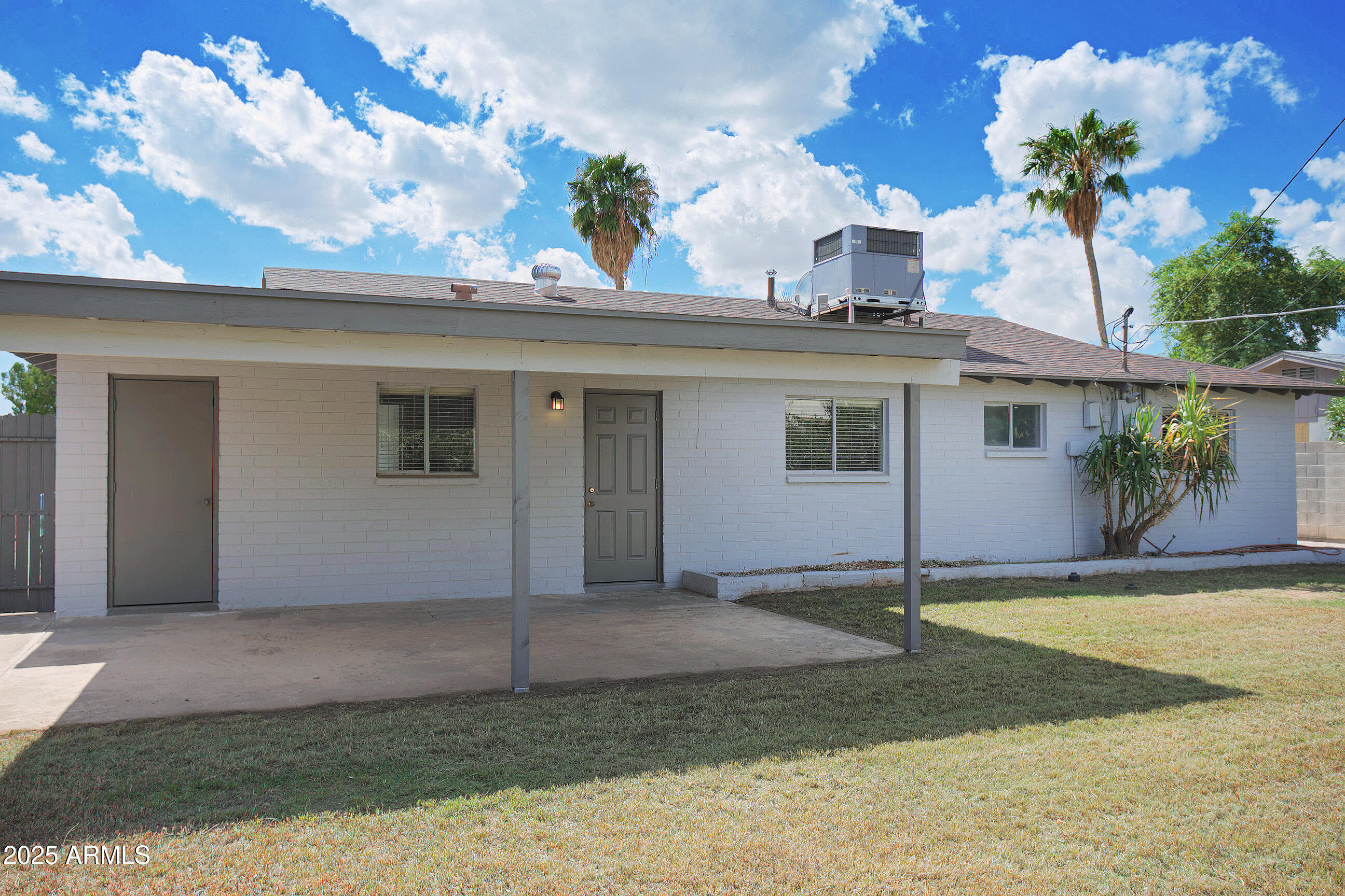 1206 West 9th Street Tempe, AZ 85281 - Photo 21 of 23 a front view of a house with a yard and garage