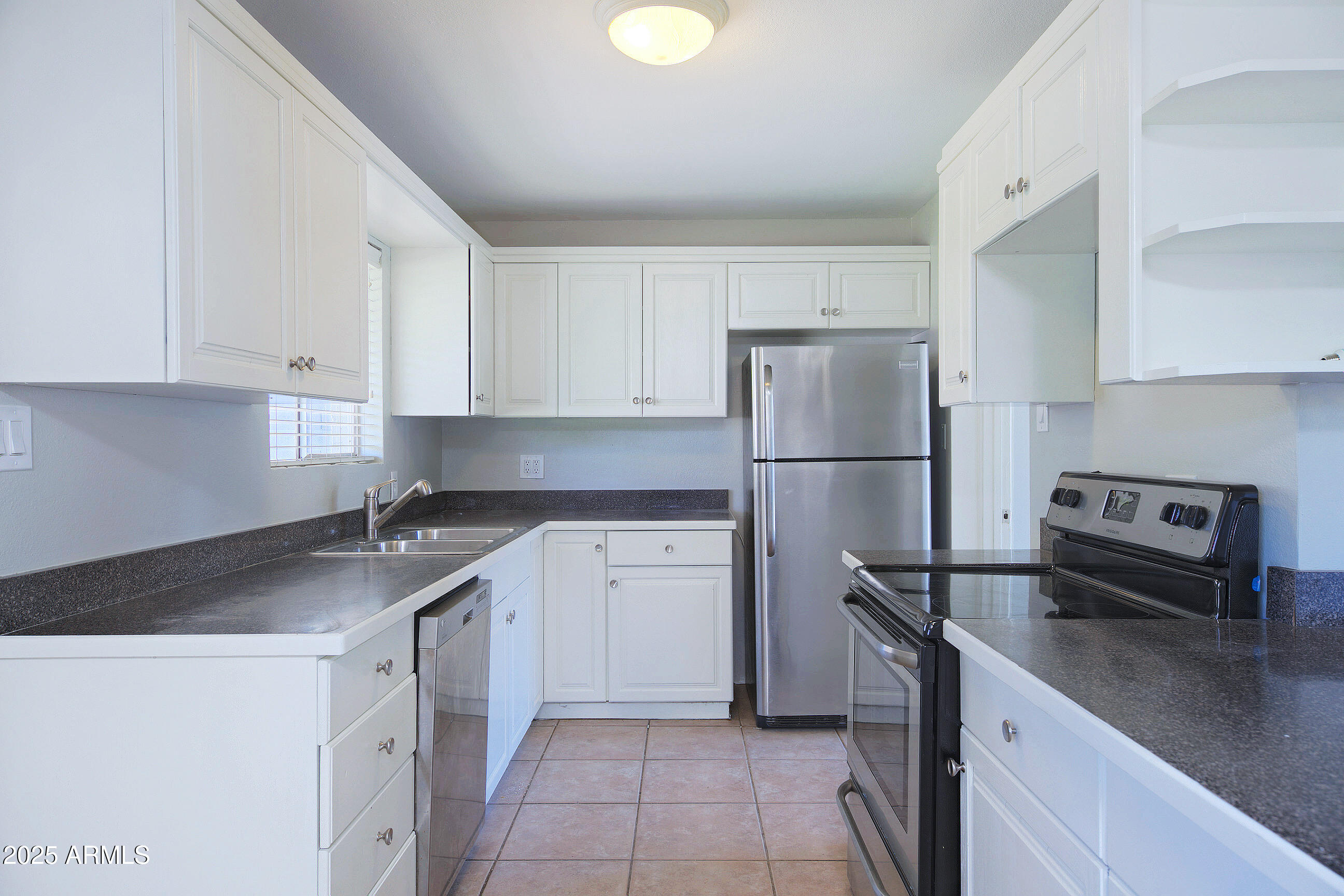 1206 West 9th Street Tempe, AZ 85281 - Photo 7 of 23 a kitchen with a refrigerator and a sink