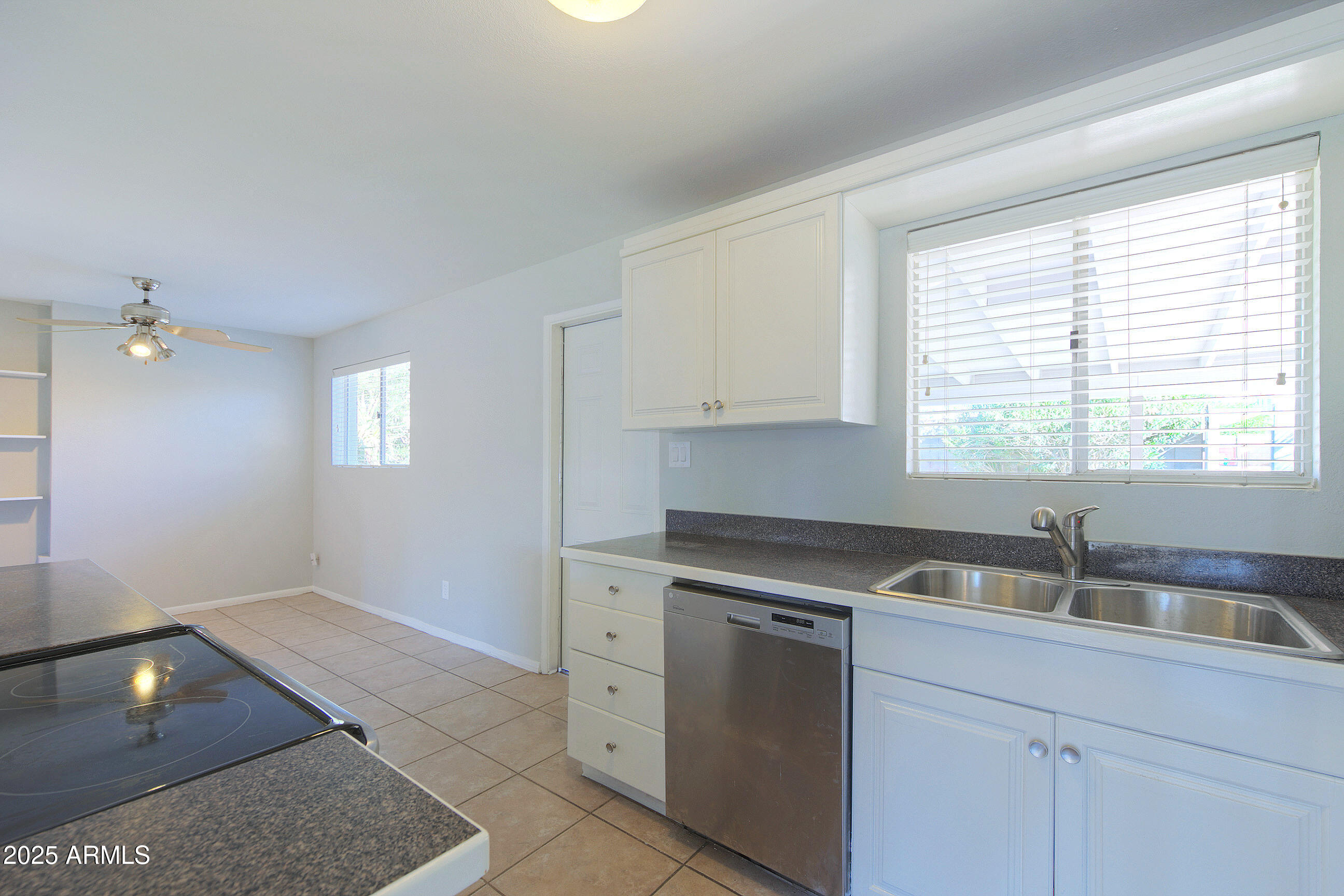 1206 West 9th Street Tempe, AZ 85281 - Photo 9 of 23 a kitchen with a sink cabinets and window