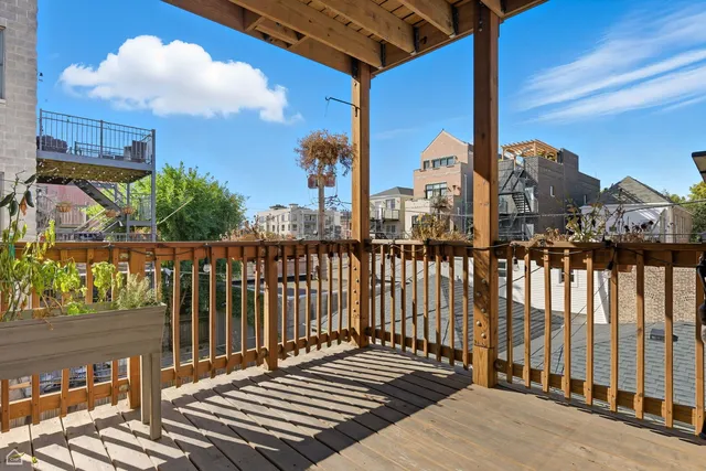 a view of a balcony with wooden floor