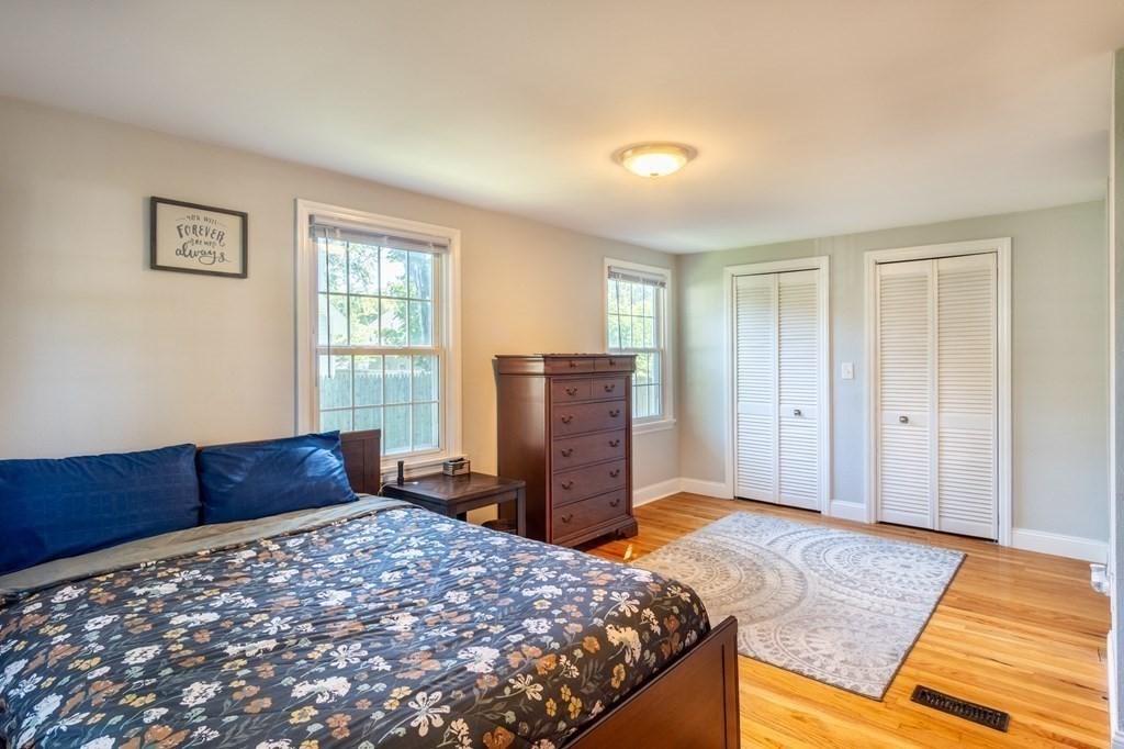 55 Lyman Street West Springfield, MA 01089 - Photo 14 of 24 a bedroom with a bed and wooden floor
