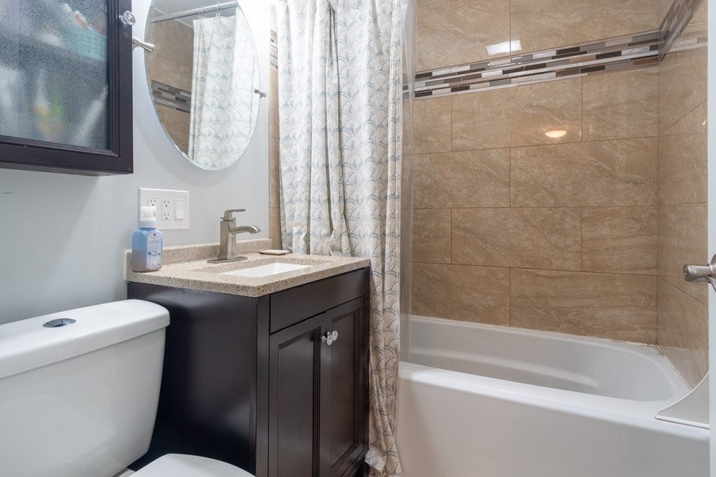 55 Lyman Street West Springfield, MA 01089 - Photo 17 of 24 a bathroom with a sink toilet and shower