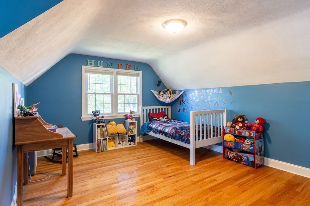 55 Lyman Street West Springfield, MA 01089 - Photo 18 of 24 a bedroom with furniture and a wooden floor