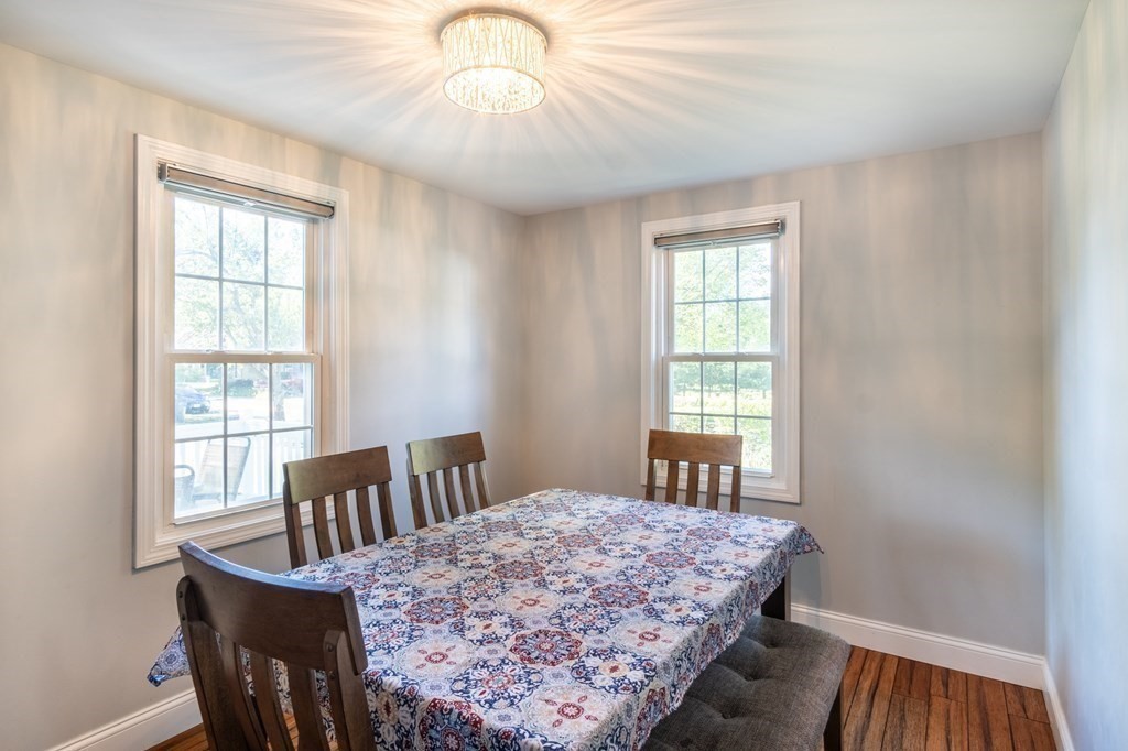 55 Lyman Street West Springfield, MA 01089 - Photo 9 of 24 a bedroom with a bed next to a window with wooden floor