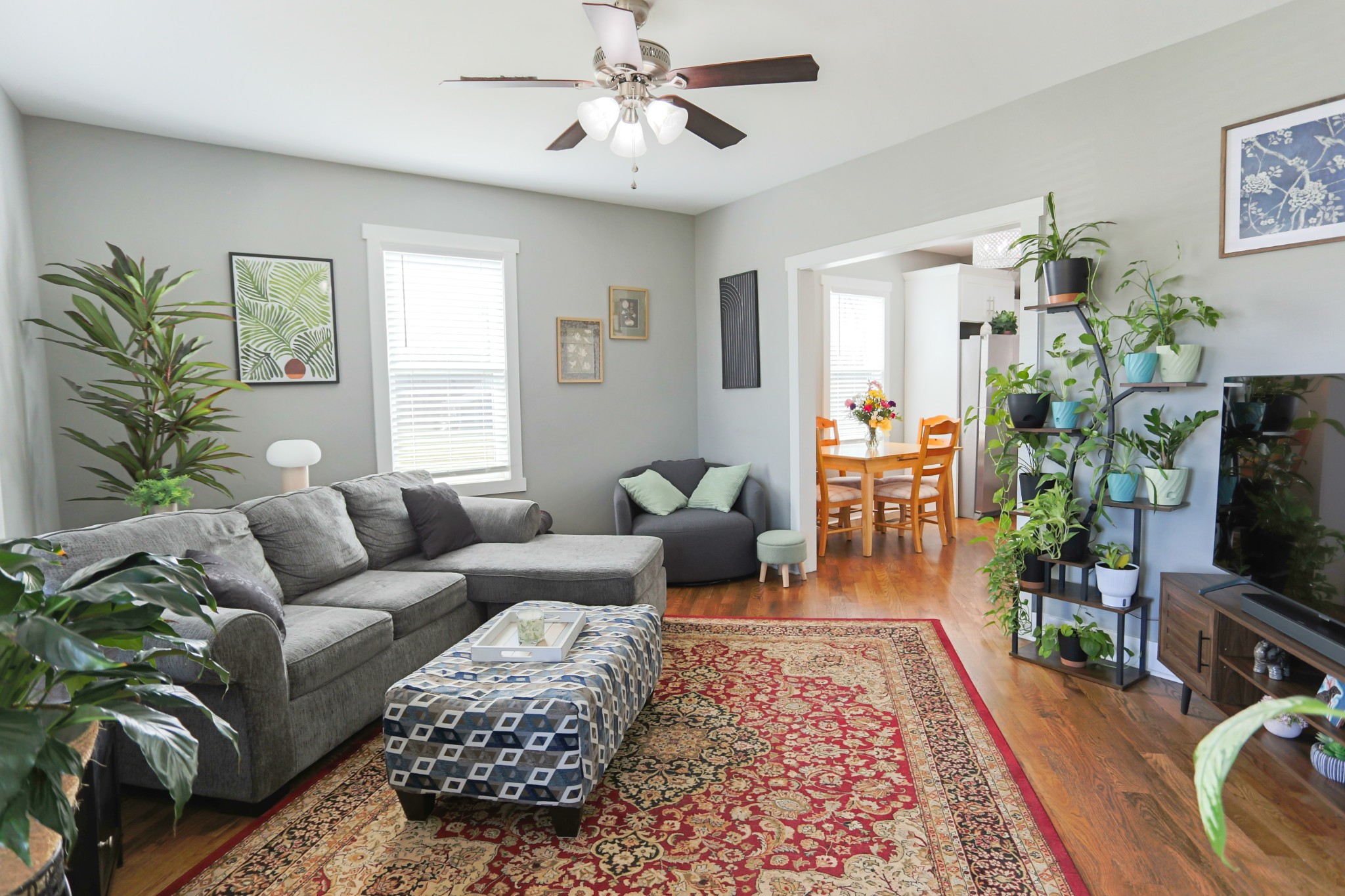 5288 Fred Perry Road Springfield, TN 37172 - Photo 13 of 36 a living room with furniture a wooden floor and a flat screen tv