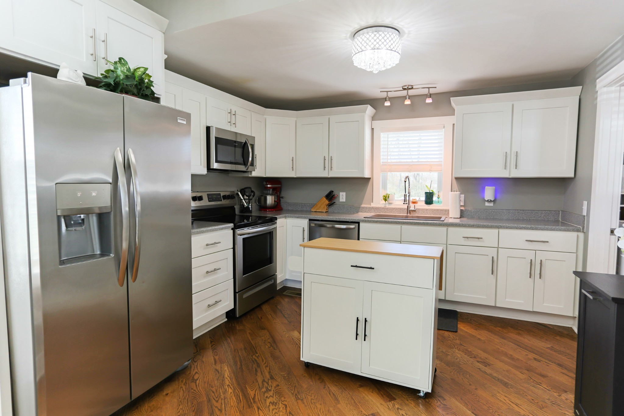5288 Fred Perry Road Springfield, TN 37172 - Photo 16 of 36 a kitchen with white cabinets stainless steel appliances and a window
