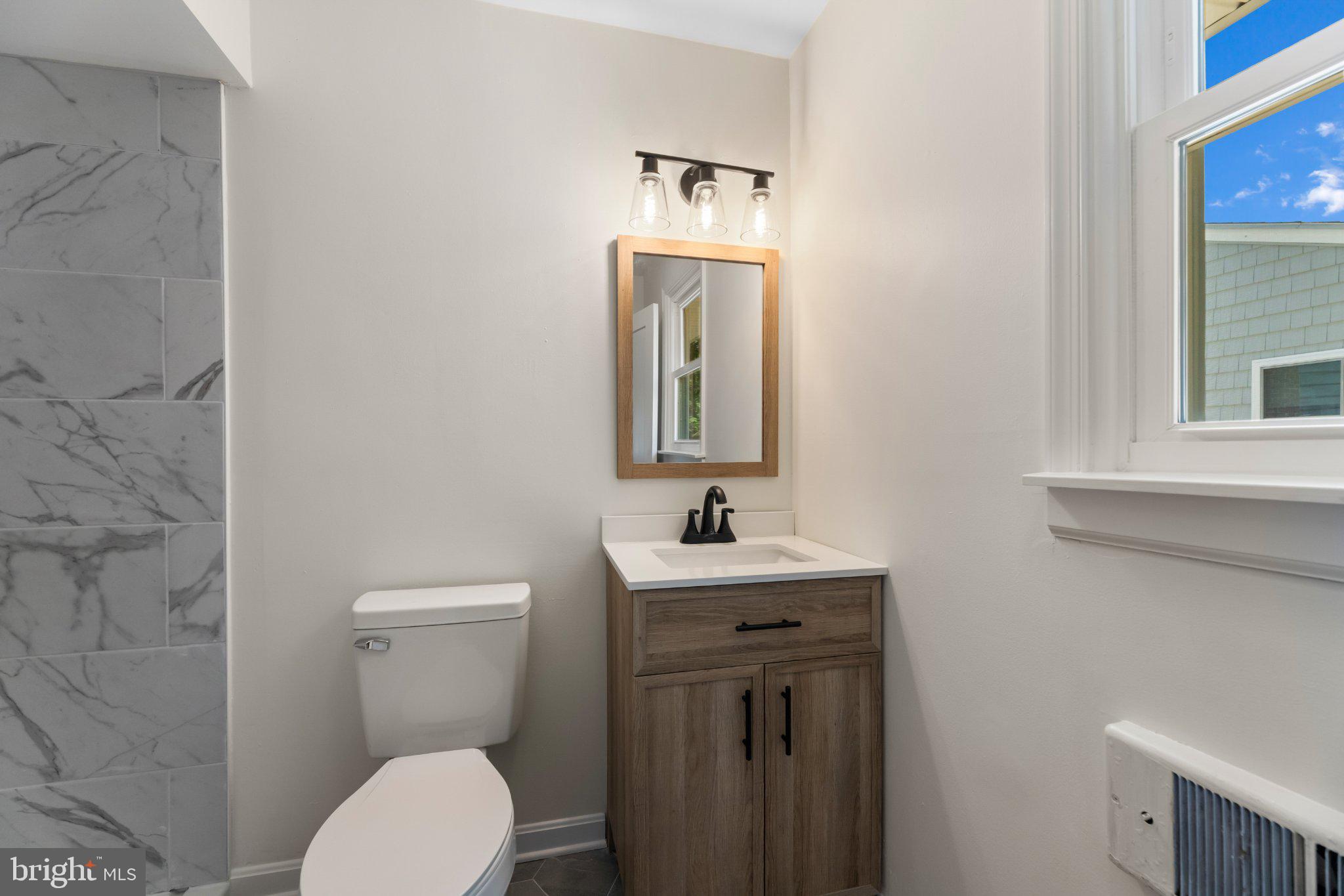 12 Oak Street Cambridge, MD 21613 - Photo 21 of 30 Modern elegance in a cozy bathroom.