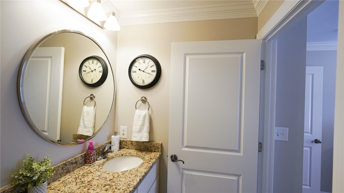 303 Lookover Drive Anderson, SC 29621 - Photo 34 of 46 This bright bathroom features a spacious vanity with elegant granite counters and a large mirror.