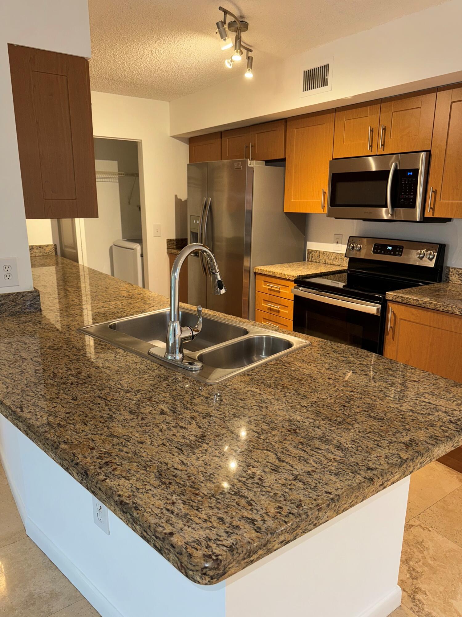 3111 Clint Moore Road, Unit 102 Boca Raton, FL 33496 - Photo 4 of 9 boca kitchen 2