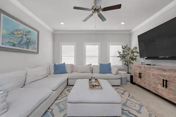 a living room with furniture and a flat screen tv