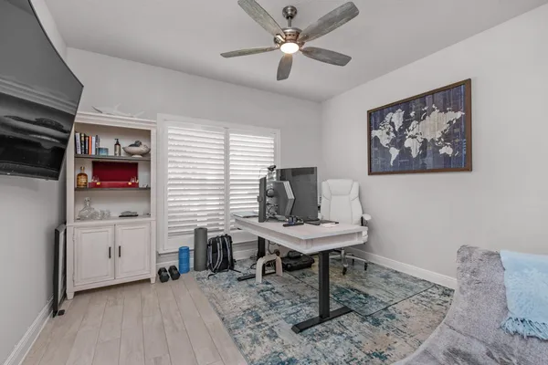 a workspace with furniture and window