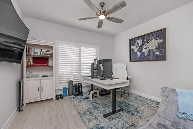 a workspace with furniture and window