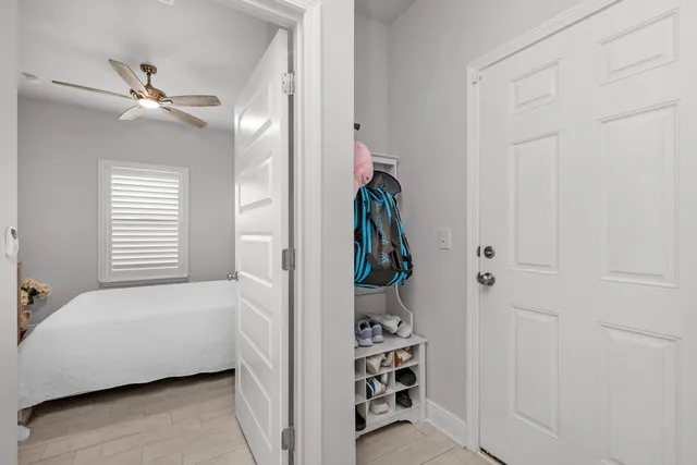 a bedroom with a bed and a window