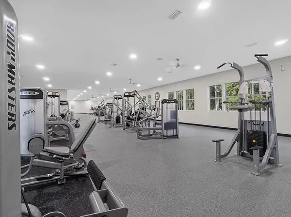 a view of patio with table and chairs and potted plants