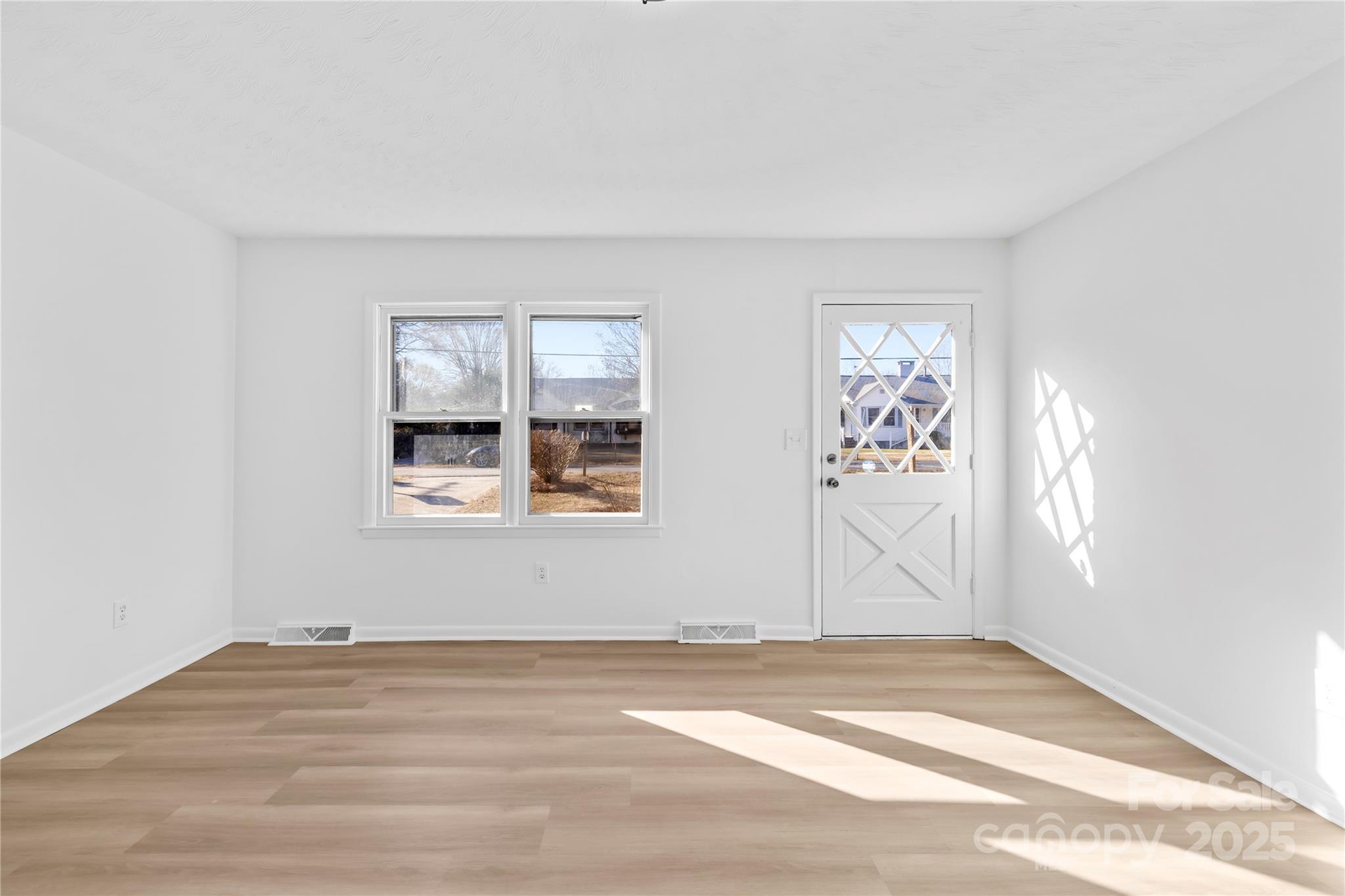 2405 Florida Avenue Kannapolis, NC 28083 - Photo 12 of 38 a view of a livingroom with wooden floor and a window