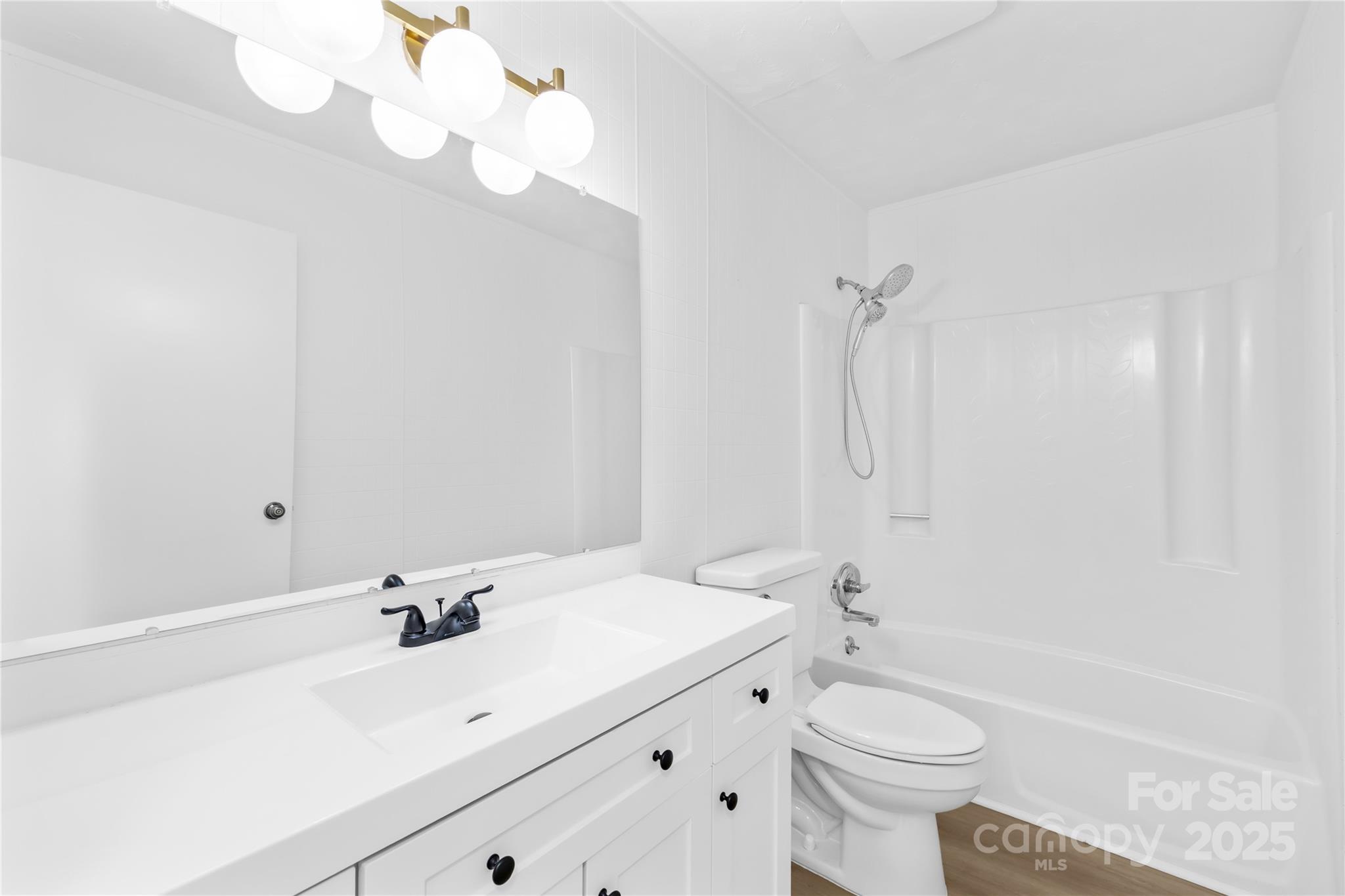 2405 Florida Avenue Kannapolis, NC 28083 - Photo 15 of 38 a bathroom with a sink a toilet and shower