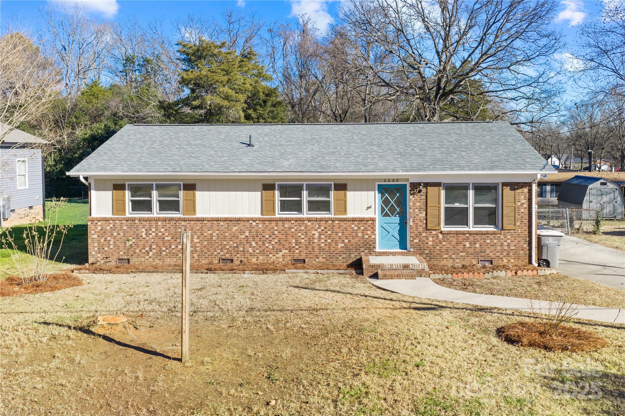 2405 Florida Avenue Kannapolis, NC 28083 - Photo 37 of 38 a front view of a house with a yard and garage