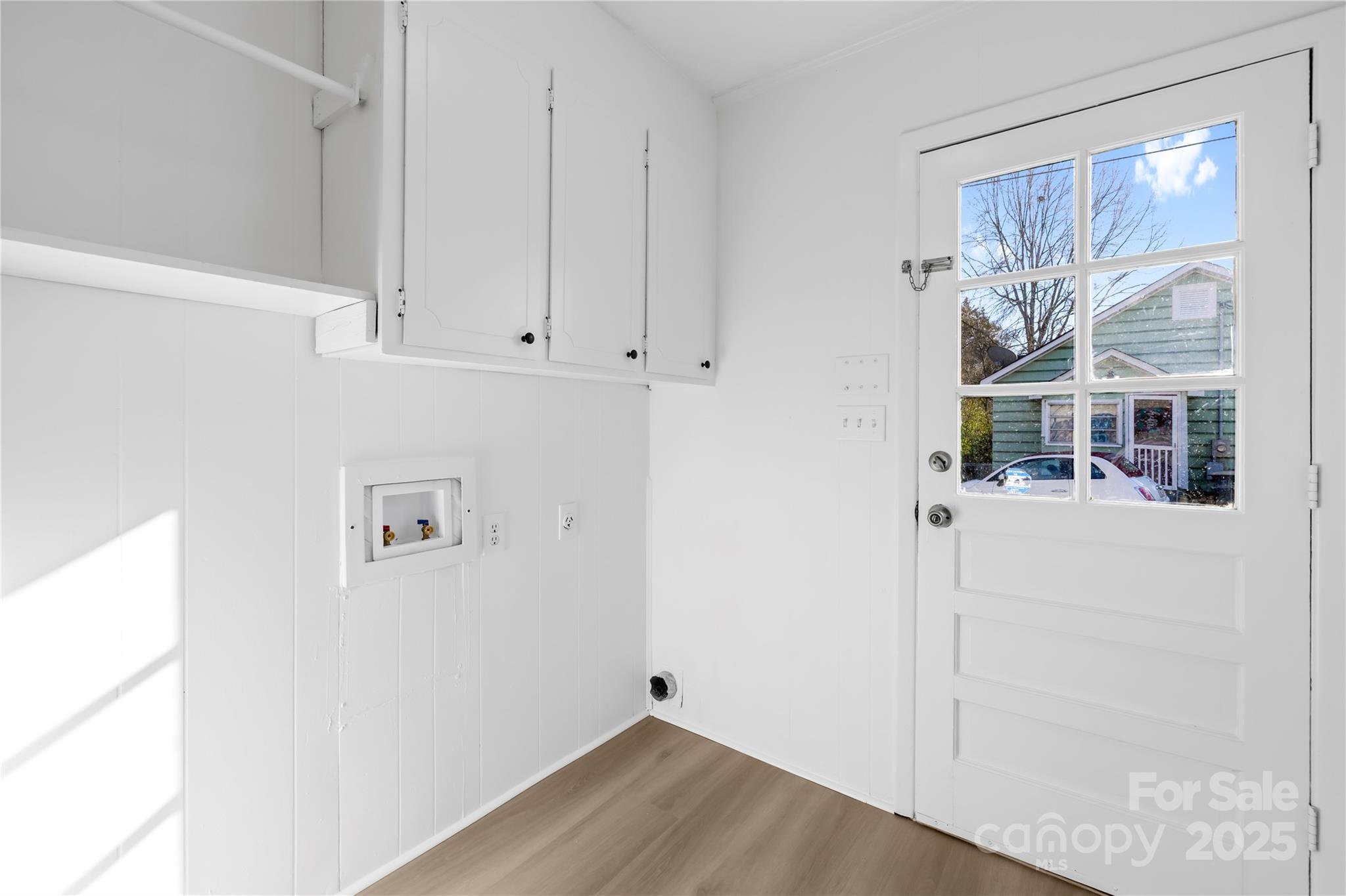 2405 Florida Avenue Kannapolis, NC 28083 - Photo 10 of 38 a view of an empty room with a window and wooden floor